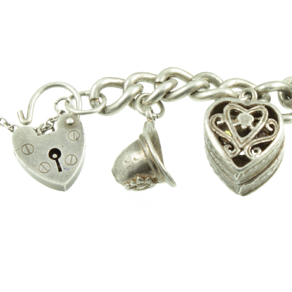 Sold at Auction: Sterling Silver Charm Bracelet