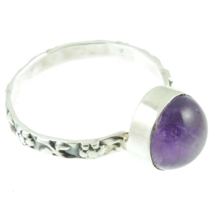 Decorative amethyst and silver ring - side view