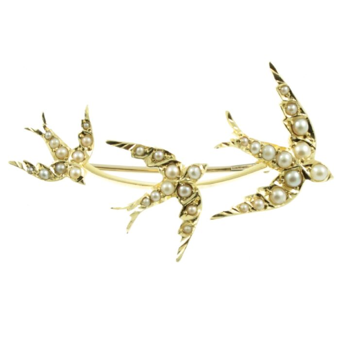 Edwardian 15ct gold swooping swallows brooch